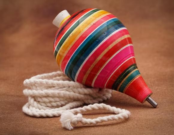 Traditional spinning top and rope